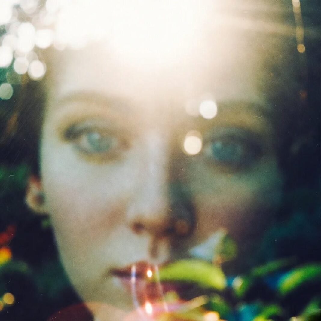 Dreamy blurred lights through scratched glass